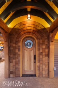 english-cottage-garage-timbers-shingles-arched-doorway