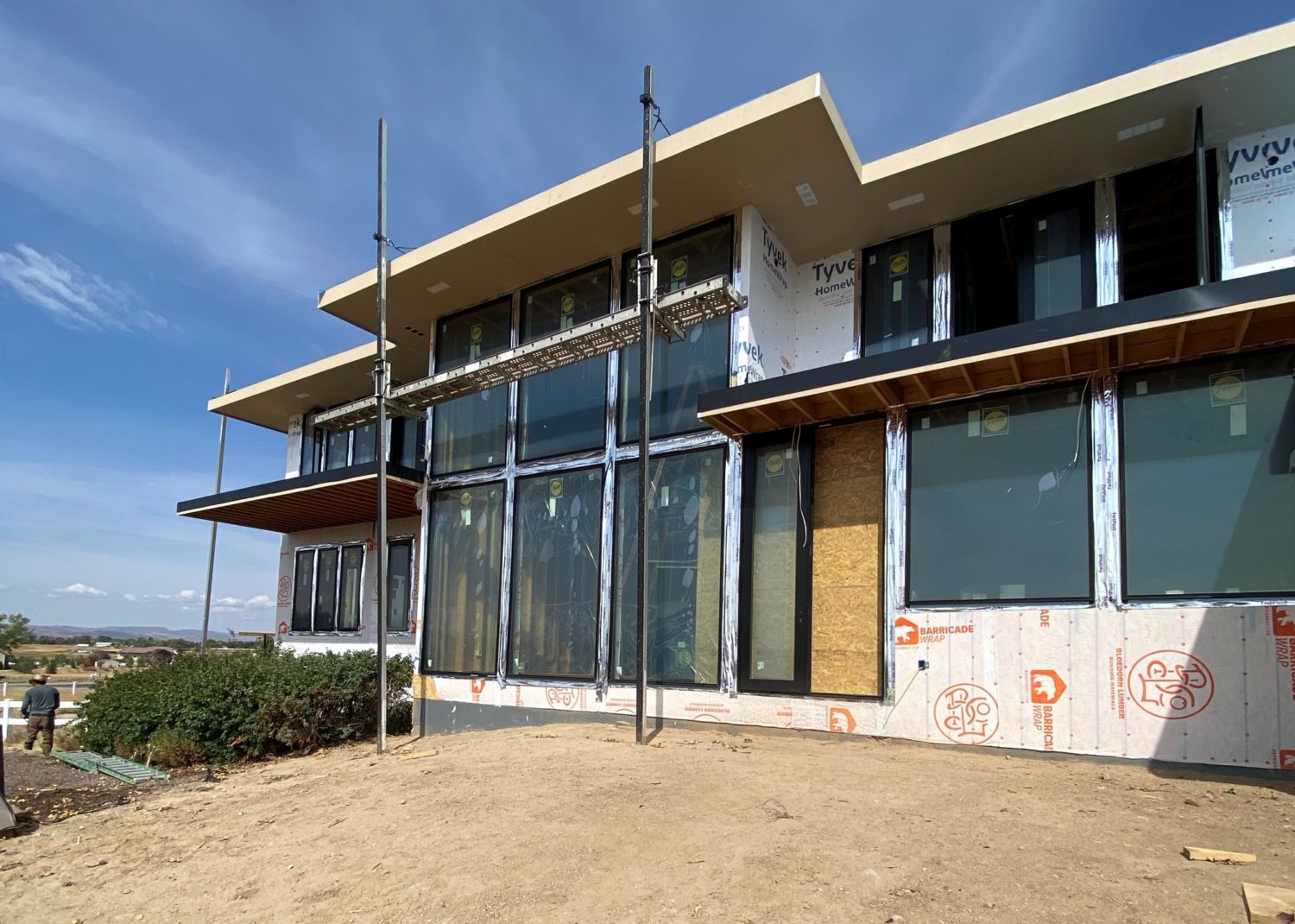 custom-home-construction-back-exterior-wall-of-windows-progress