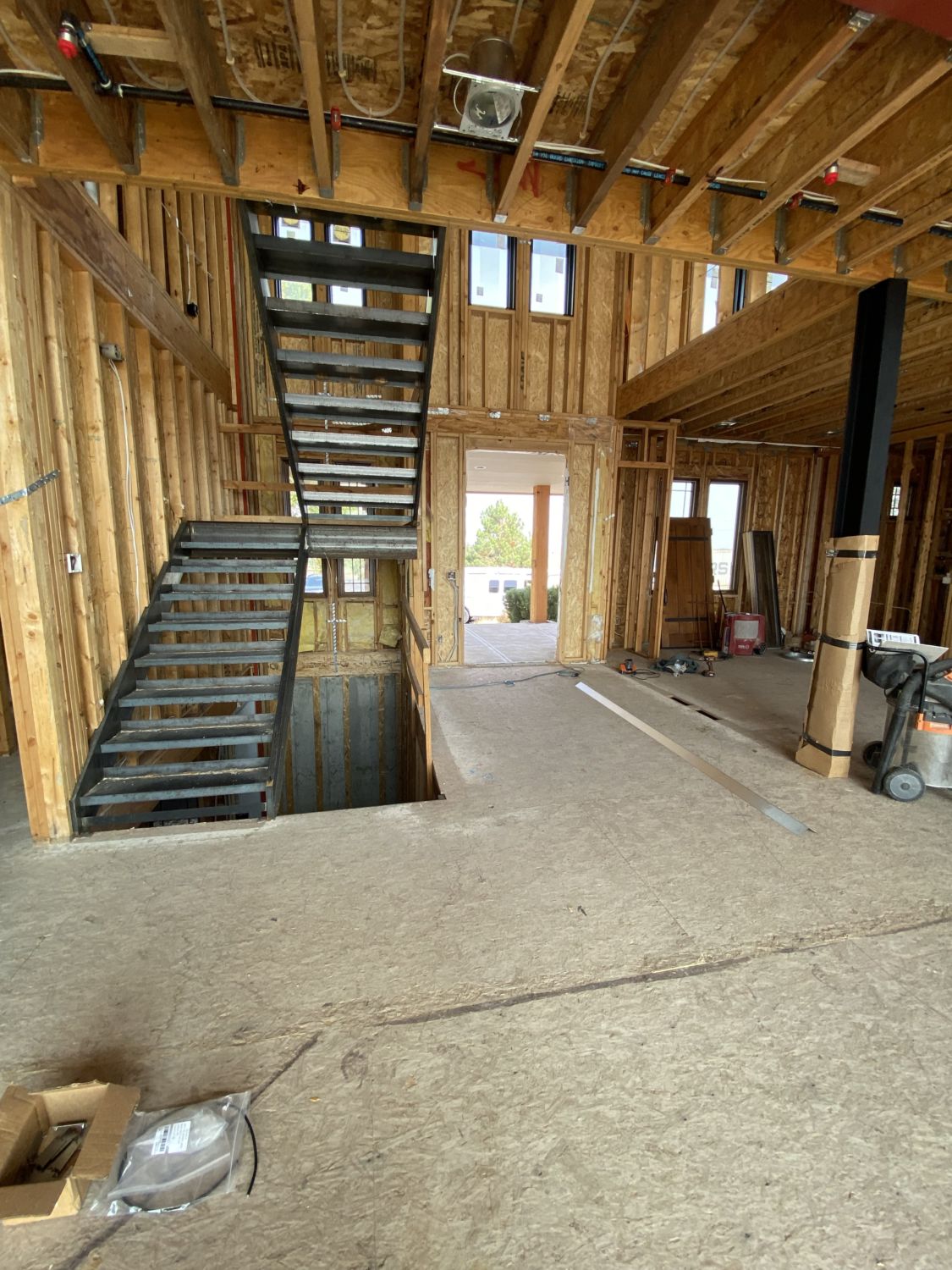 custom-home-construction-framing-metal-stairs-first-floor