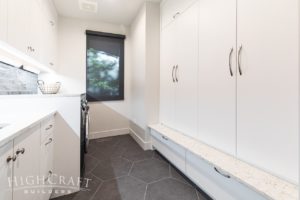 highcraft loveland custom home laundry mudroom storage cabinets-large-format-hex-tiles-flooring