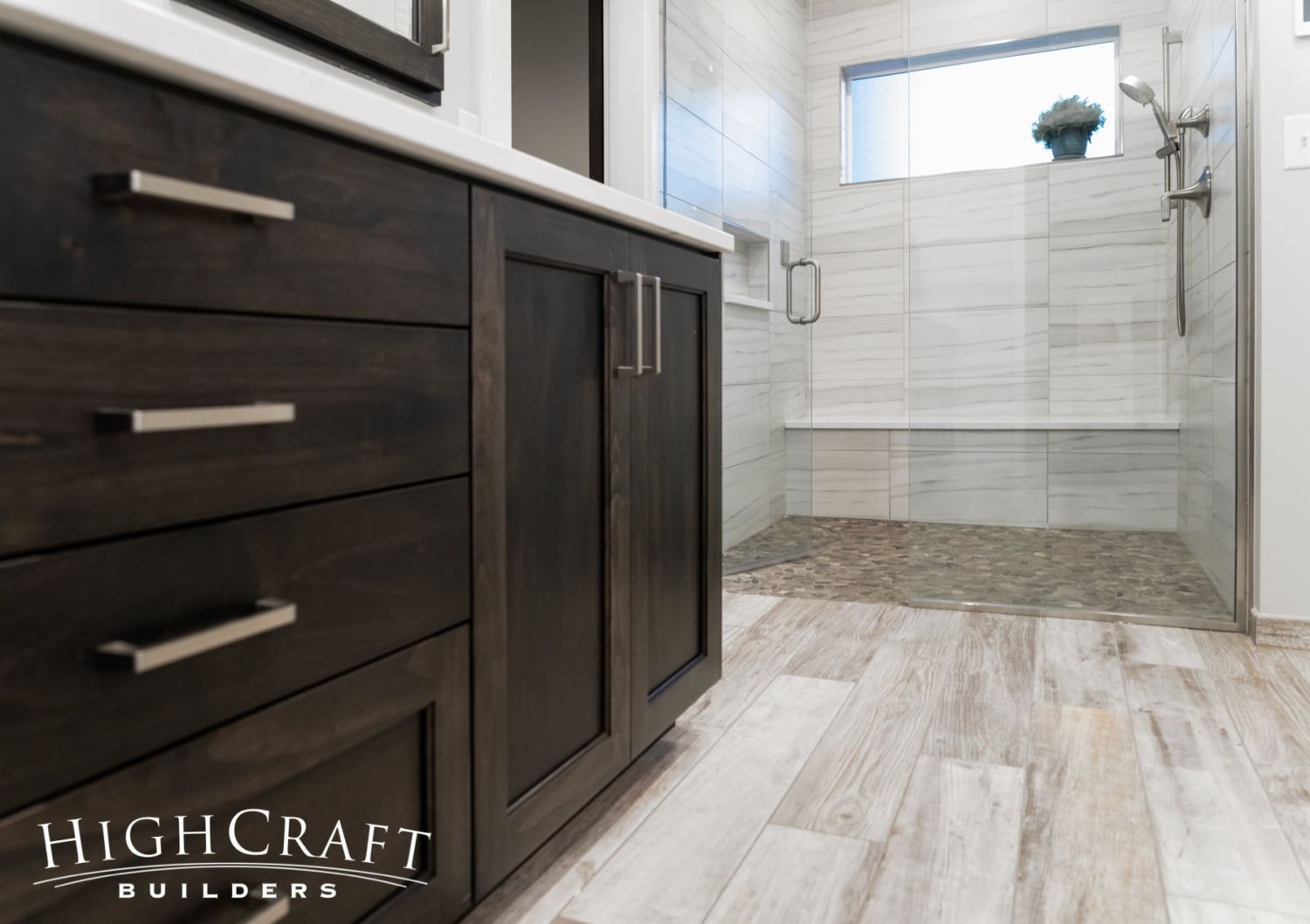 master-bathroom-remodel-brown-cabinetry-glass-shower-doors