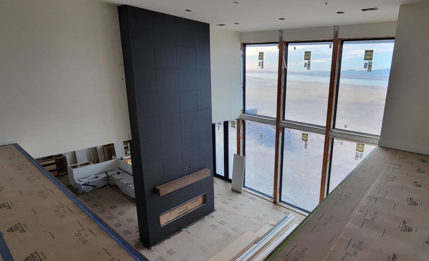 custom-home-black-tile-fireplace-surround-view-from-catwalk