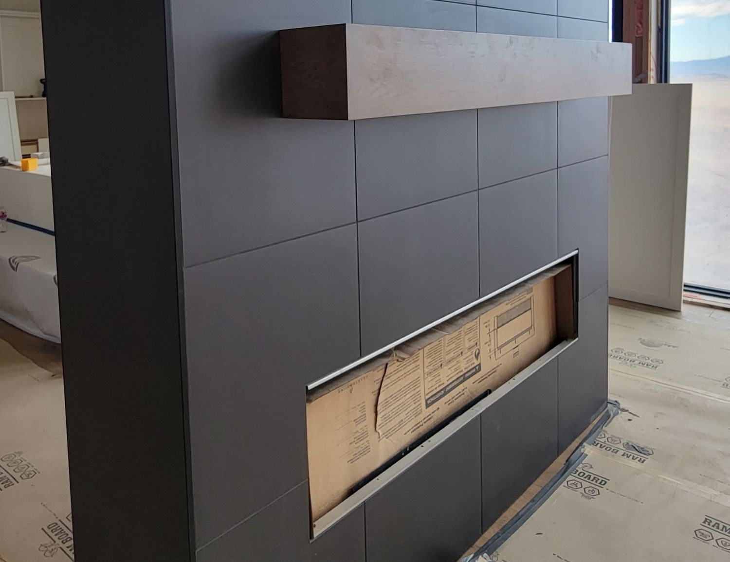 custom-home-living-room-fireplace-black-tile-surround-closeup