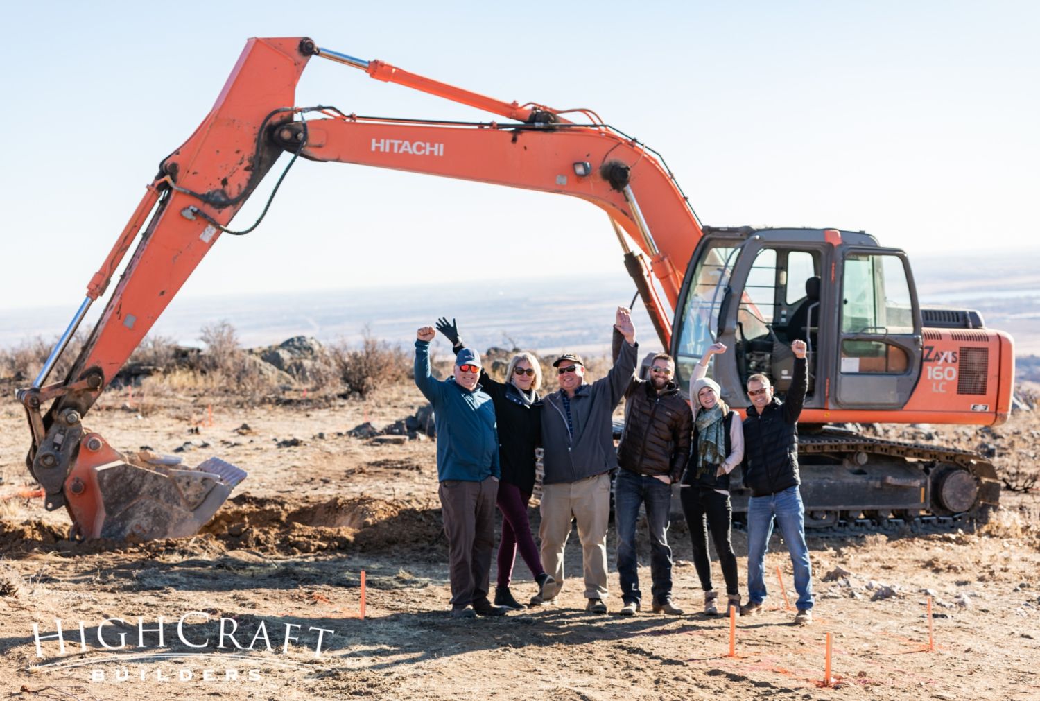 custom-home-groundbreaking-northern-colorado-HighCraft-design-build-team-with-clients-victory-arms