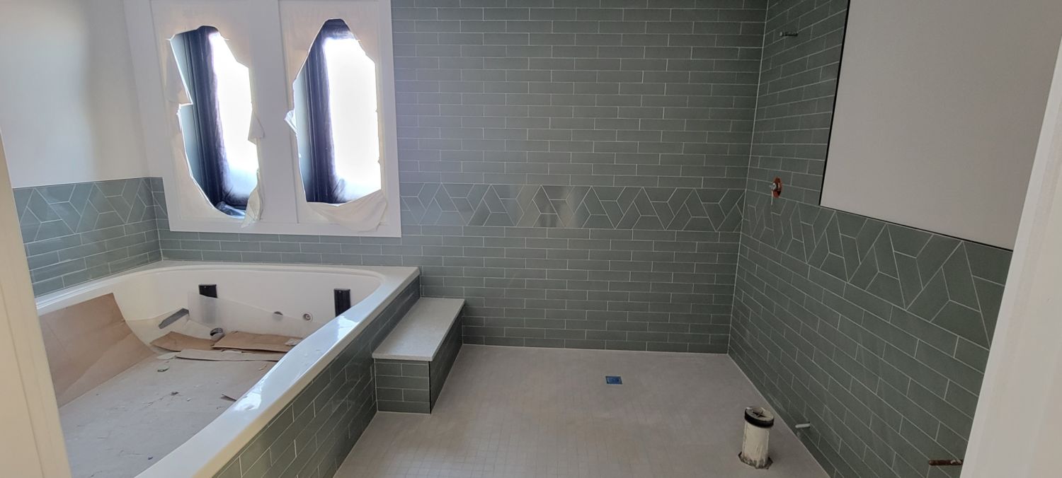 whole-house-remodel-basement-float-room-gray-tile-installation
