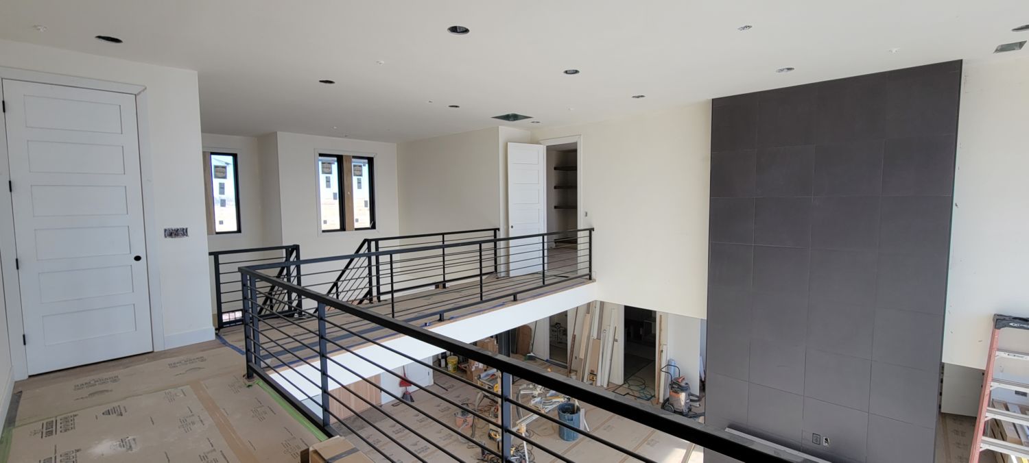 whole-house-remodel-black-metail-railings-installation-catwalk