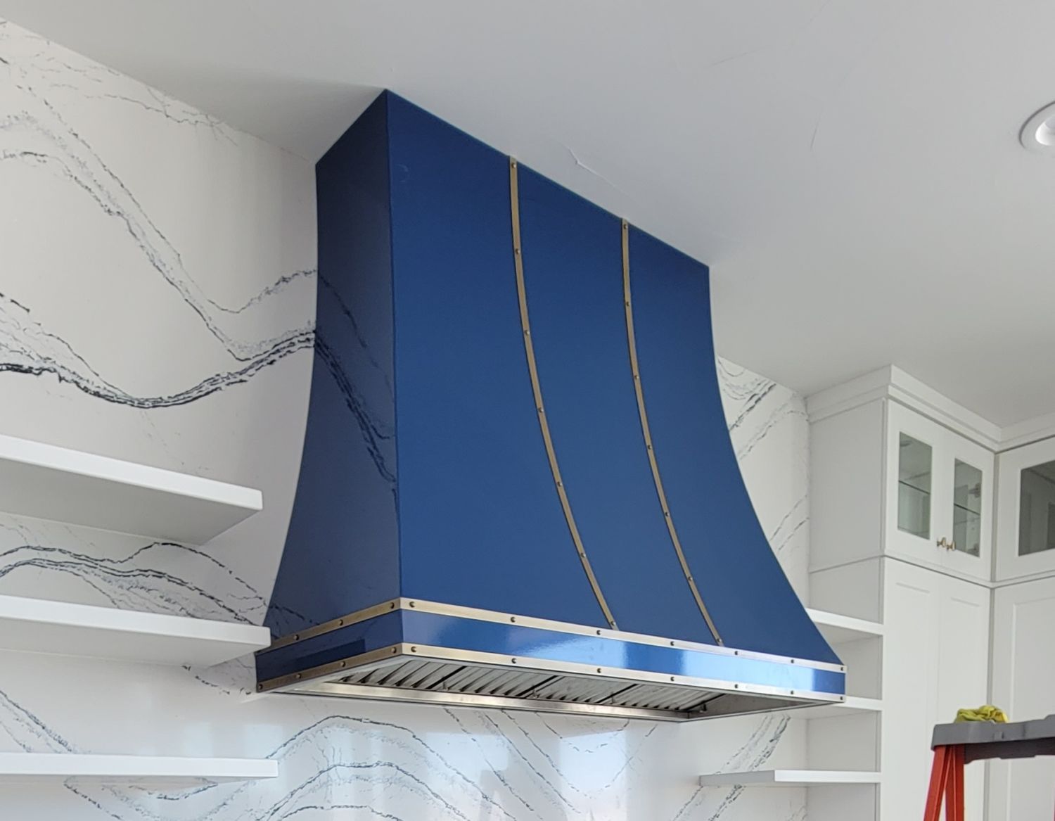 kitchen-remodel-blue-range-hood-with-strapping-rivets