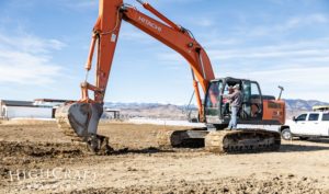 custom-home-groundbreaking-heron-lakes-orange-excavator-scott