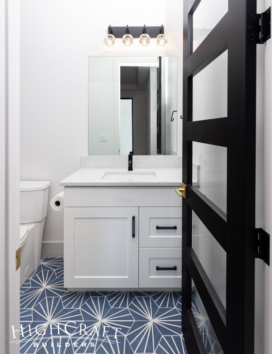 bathroom-remodel-blue-starburst-hex-tiles-black-door