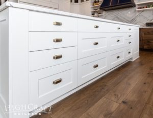 whole-house-remodel-kitchen-white-base-cabinets-island-brass-bin-pulls