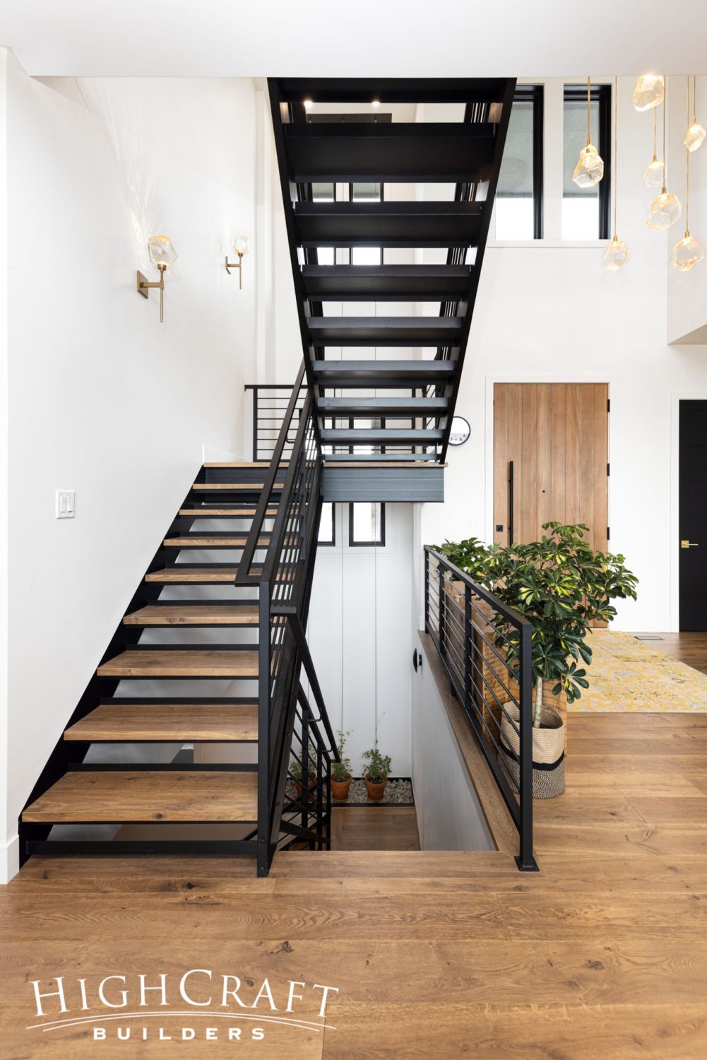 whole-house-remodel-black-metal-stairs-front-entry