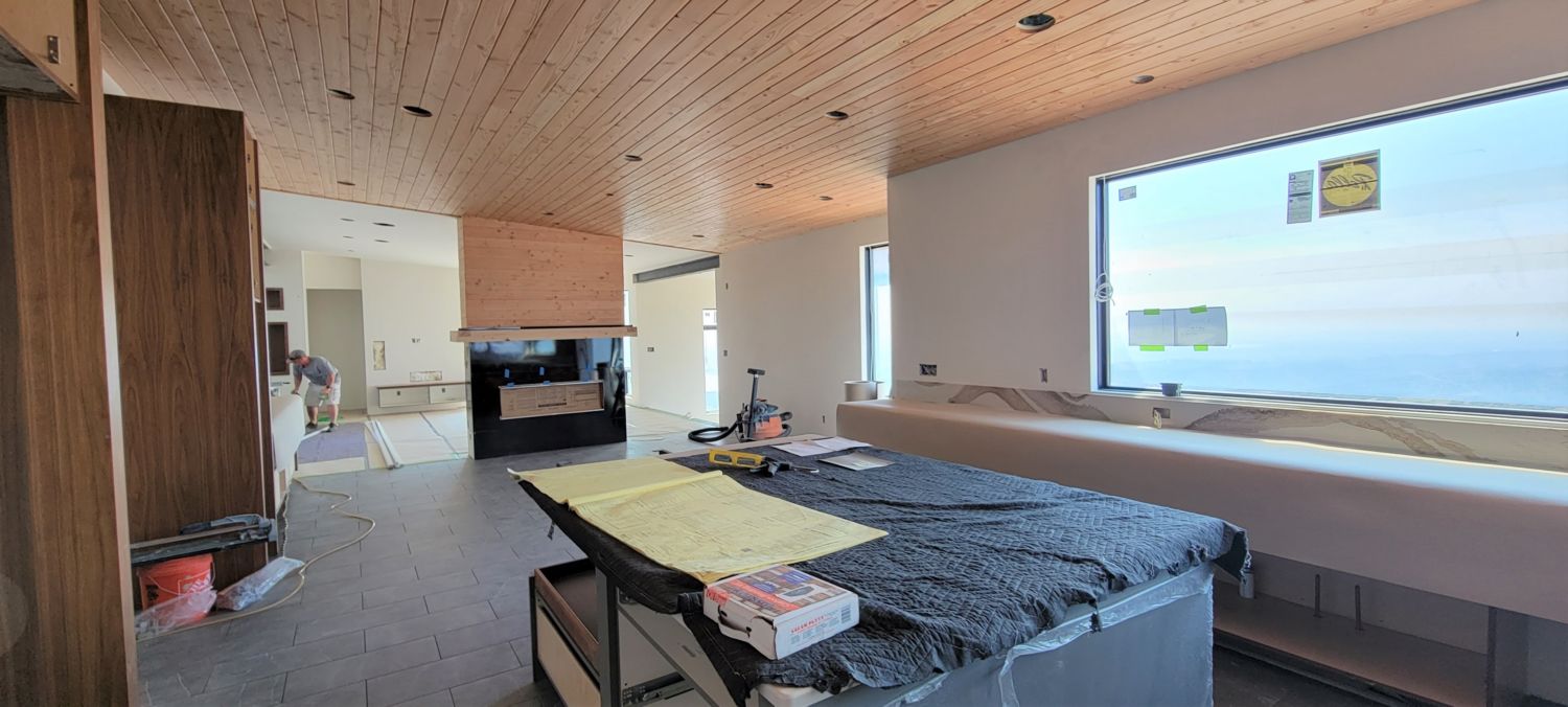 mountain-modern-custom-home-builder-fireplace-kitchen-window