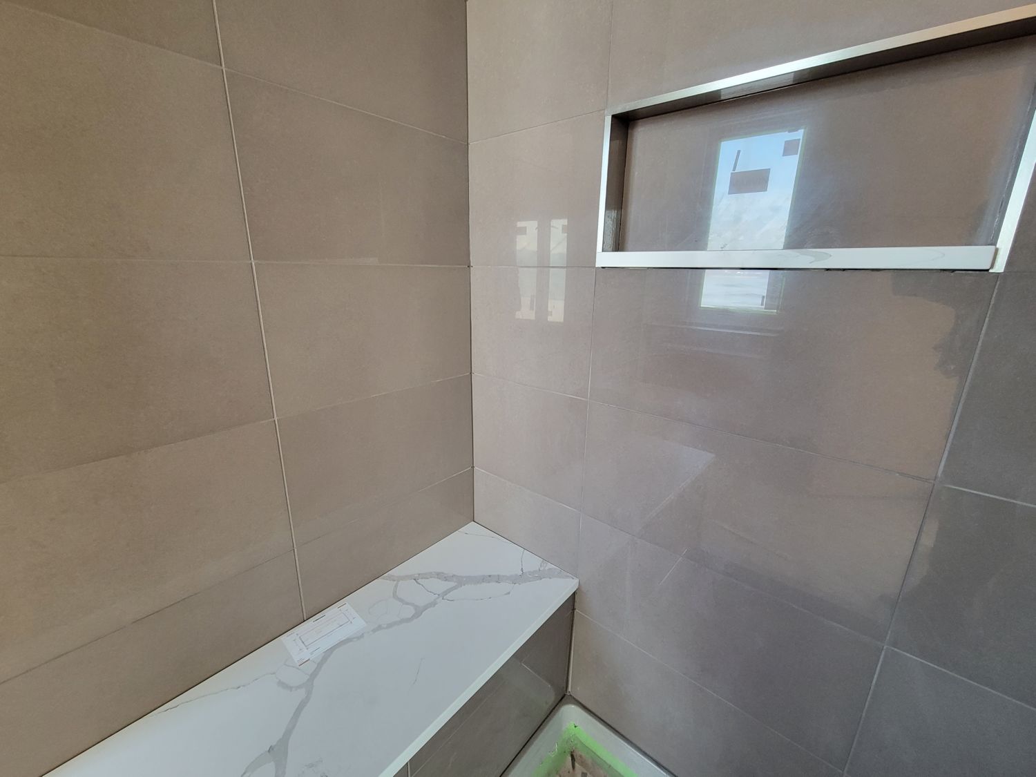 custom-home-builder-berthoud-bathroom-glossy-tile-shower-progress