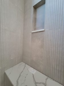 custom-home-builder-berthoud-bathroom-grooved-tile-shower-progress