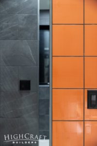 custom-home-builder-near-me-mountain-property-loveland-co-master-bathroom-shower-tile-orange