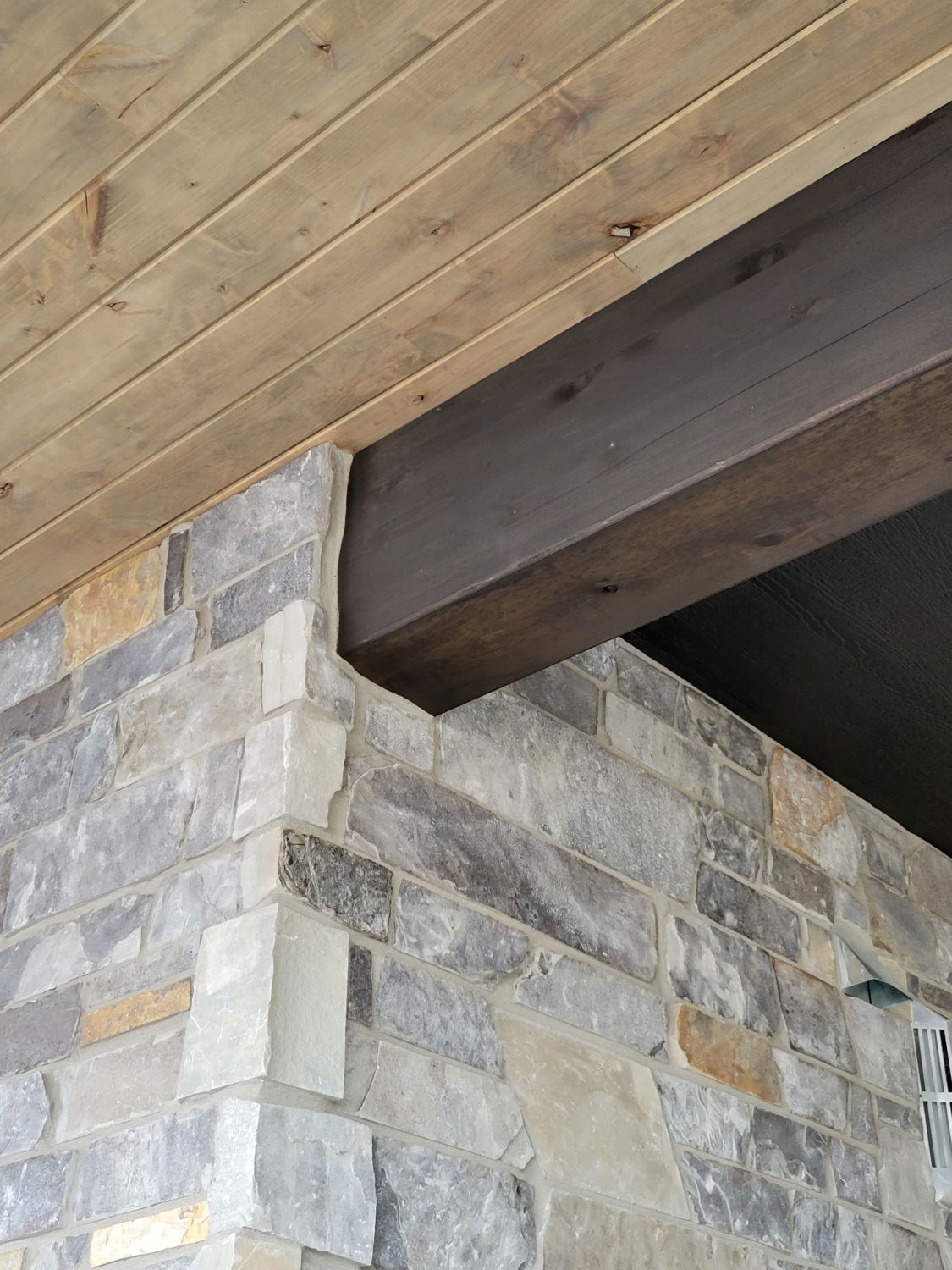 custom-home-builder-exterior-stone-beam-stain-perfection