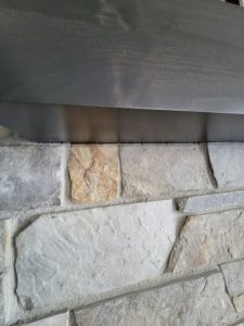 ustom-home-builder-fireplace-wall-stone-trim-detail