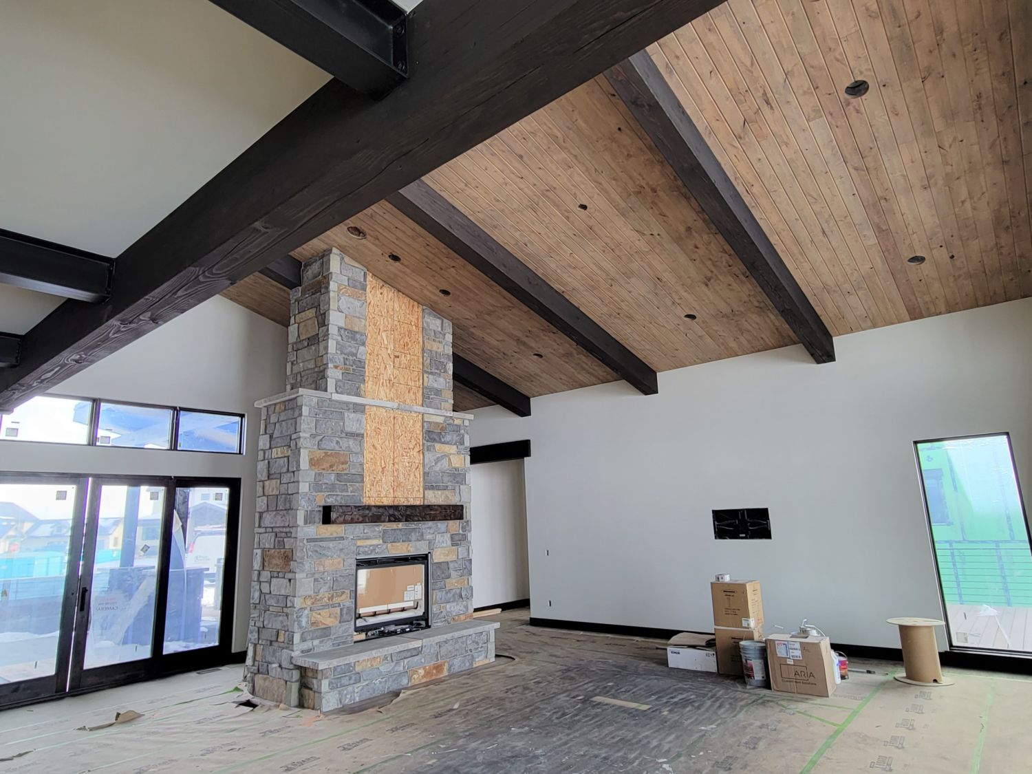 custom-home-builder-tongue-and-groove-ceiling-beams-progress-fireplace