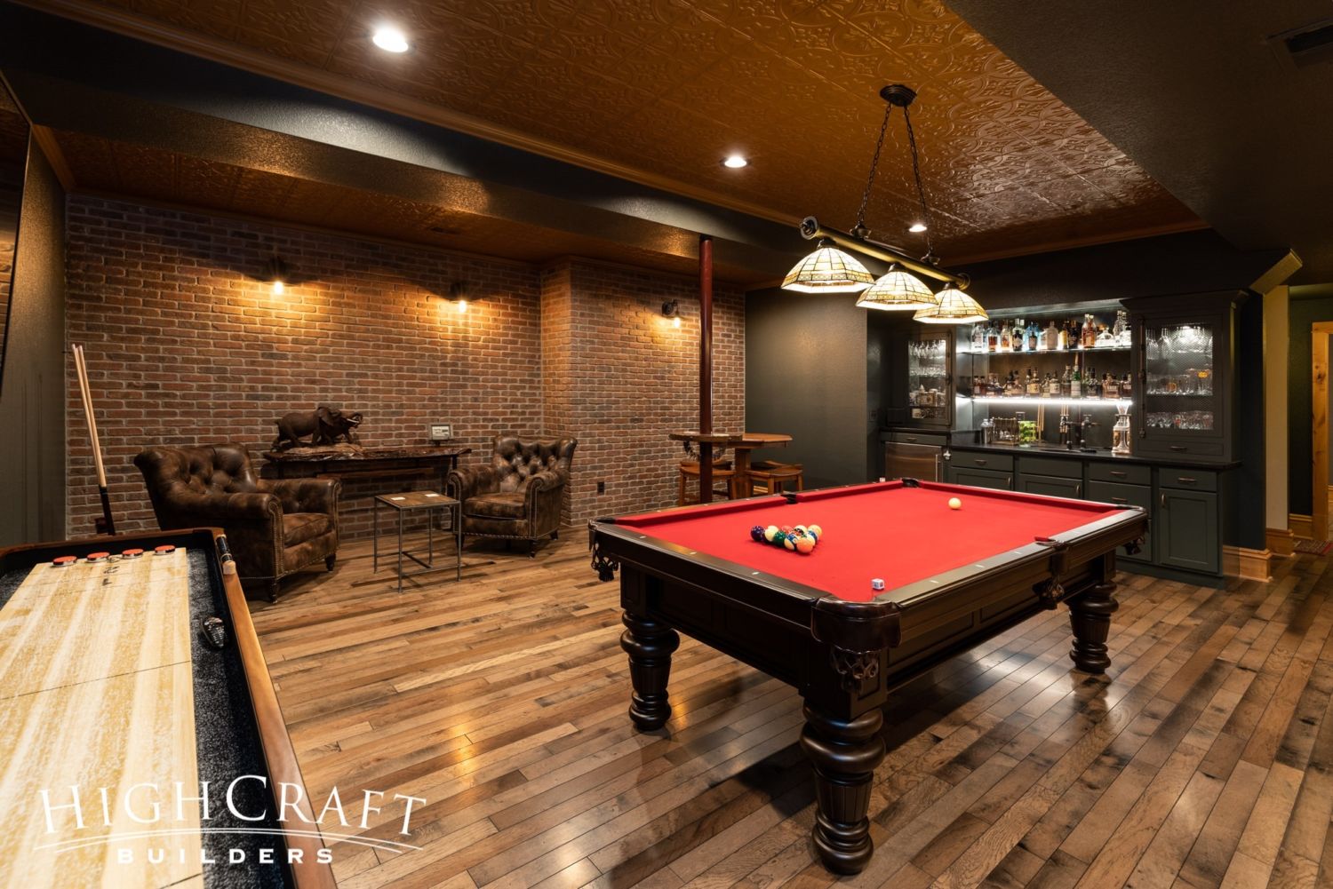 basement-finish-fort-collins-speakeasy-red-pool-table-wet-bar-seating-tin-ceiling