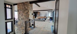 mountain-modern-custom-home-fireplace-stone-stair-railing-progress