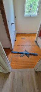 whole-house-remodel-hall-bathroom-flooring-progress