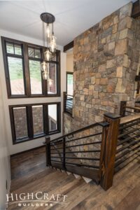 custom-home-stone-wall-stairwell