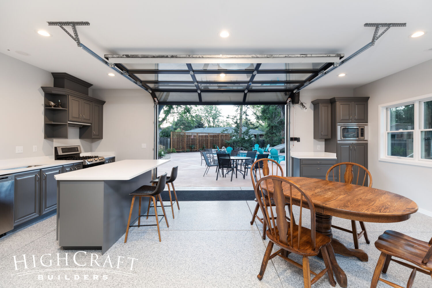 Kitchen-Bath-Pool-House-epoxy-flooring-glass-paneled-garage-door-open