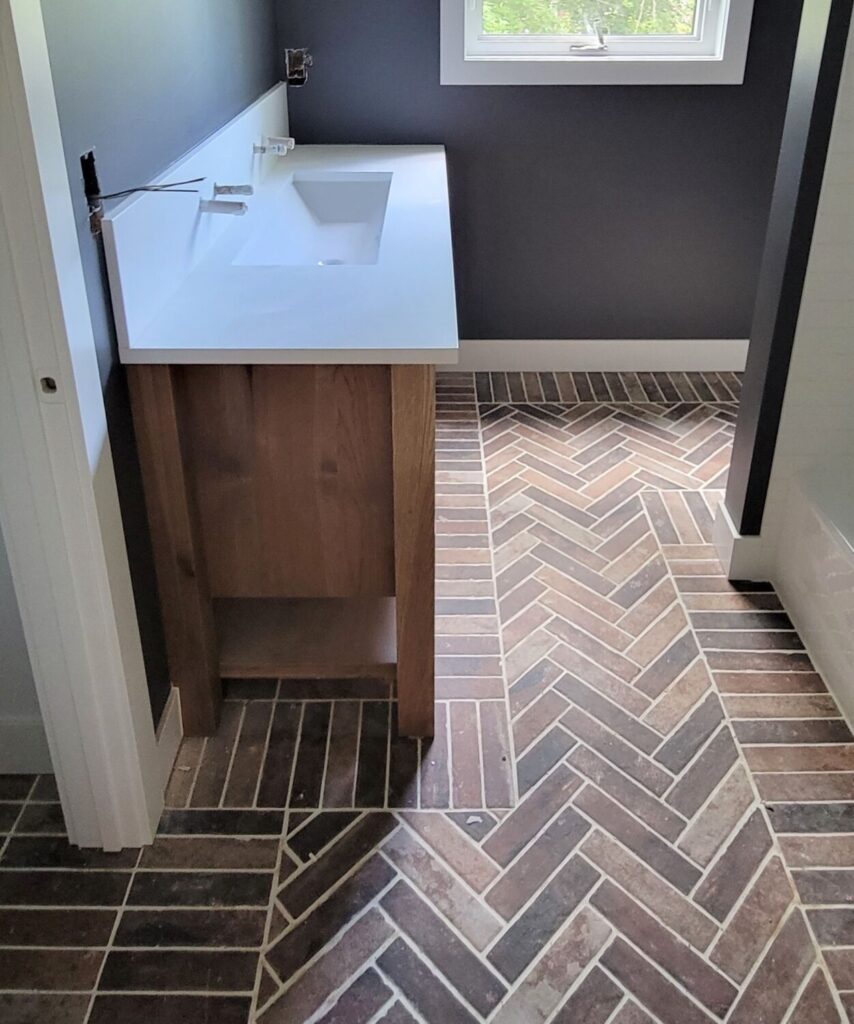 bathroom-remodel-brick-tile-floor-sink