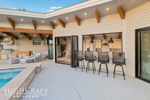 pool-house-builder-near-me-indoor-outdoor-living-bifold-doors-bar-seating