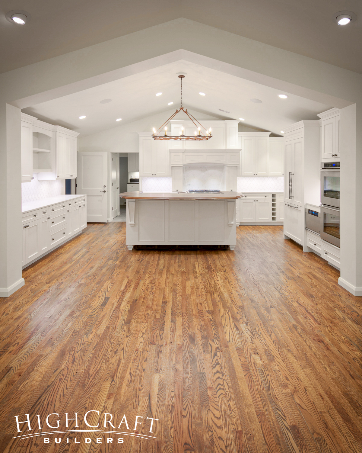 Kitchen-And-Great-Room-Addition-Oak-Flooring-White-Cabinets-Transitional-Island-Chandelier