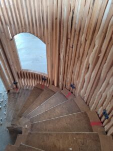 curve-stairs-interior-framing-arch-opening-progress