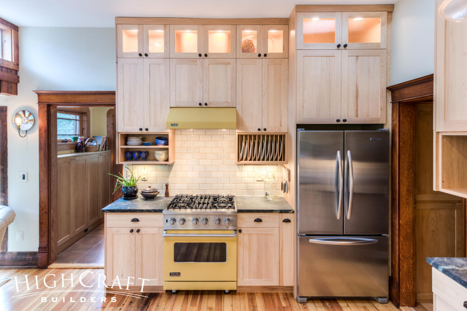 Historic-Second-Story-Addition-Light-Cabinetry-Yellow-Range-Plate-Storage