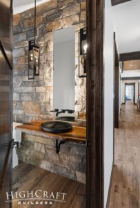 custom-home-builder-berthoud-powder-bathroom-stone-wall