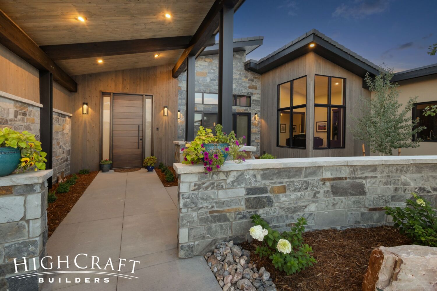 custom-home-builder-near-me-berthoud-exterior-front-entry-stone-wall
