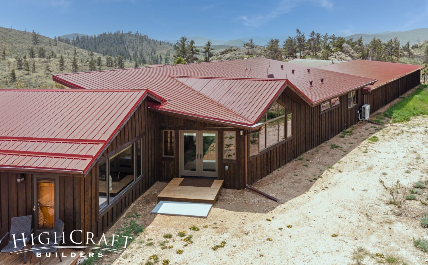 Master-Suite-Addition-Mountain-Ranch-Exterior-red-metal-roof