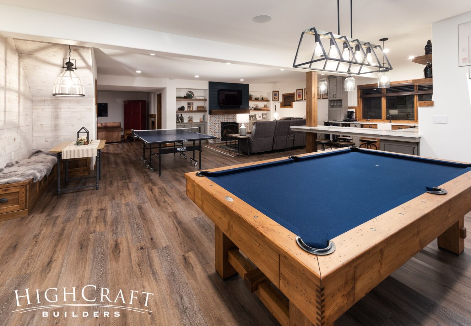 basement-remodel-banquette-seating-under-stairs-pool-table
