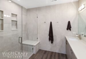 basement-bathroom-remodel-frameless-glass-shower-tile-accent-wall