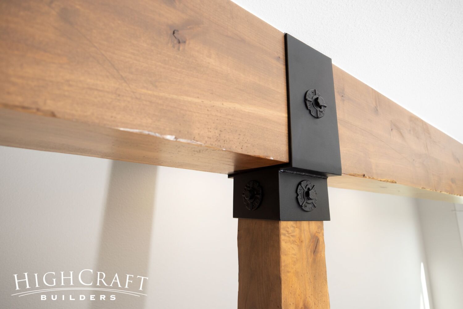 basement-remodel-timber-beam-post-metal-brace
