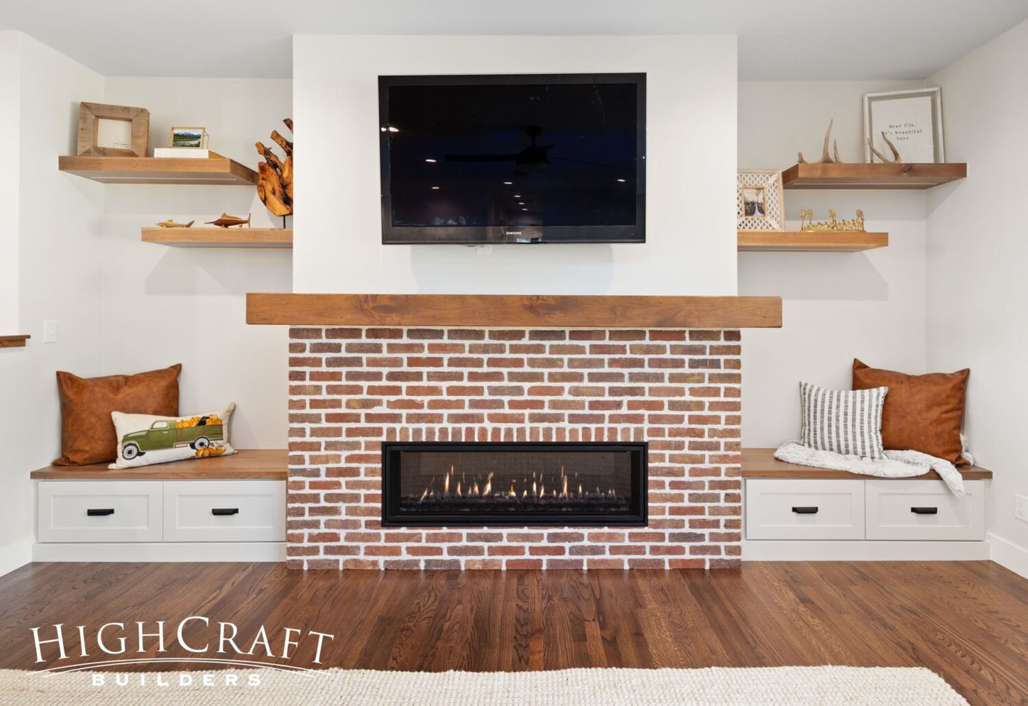 house-remodel-fort-collins-brick-fireplace-built-in-benches-drawers-floating-shelves-TV