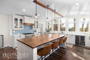 kitchen-remodel-blue-tile-center-island-white-tongue-and-groove-ceiling