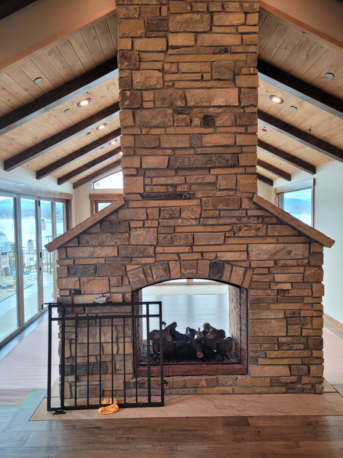 Grand-Waterfront-Retreat-Outdoor-Kitchen-Fireplace