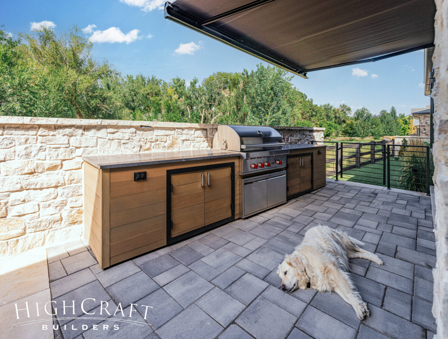 fort-collins-custom-home-build-back-patio-outdoor-kitchen-dog-pavers