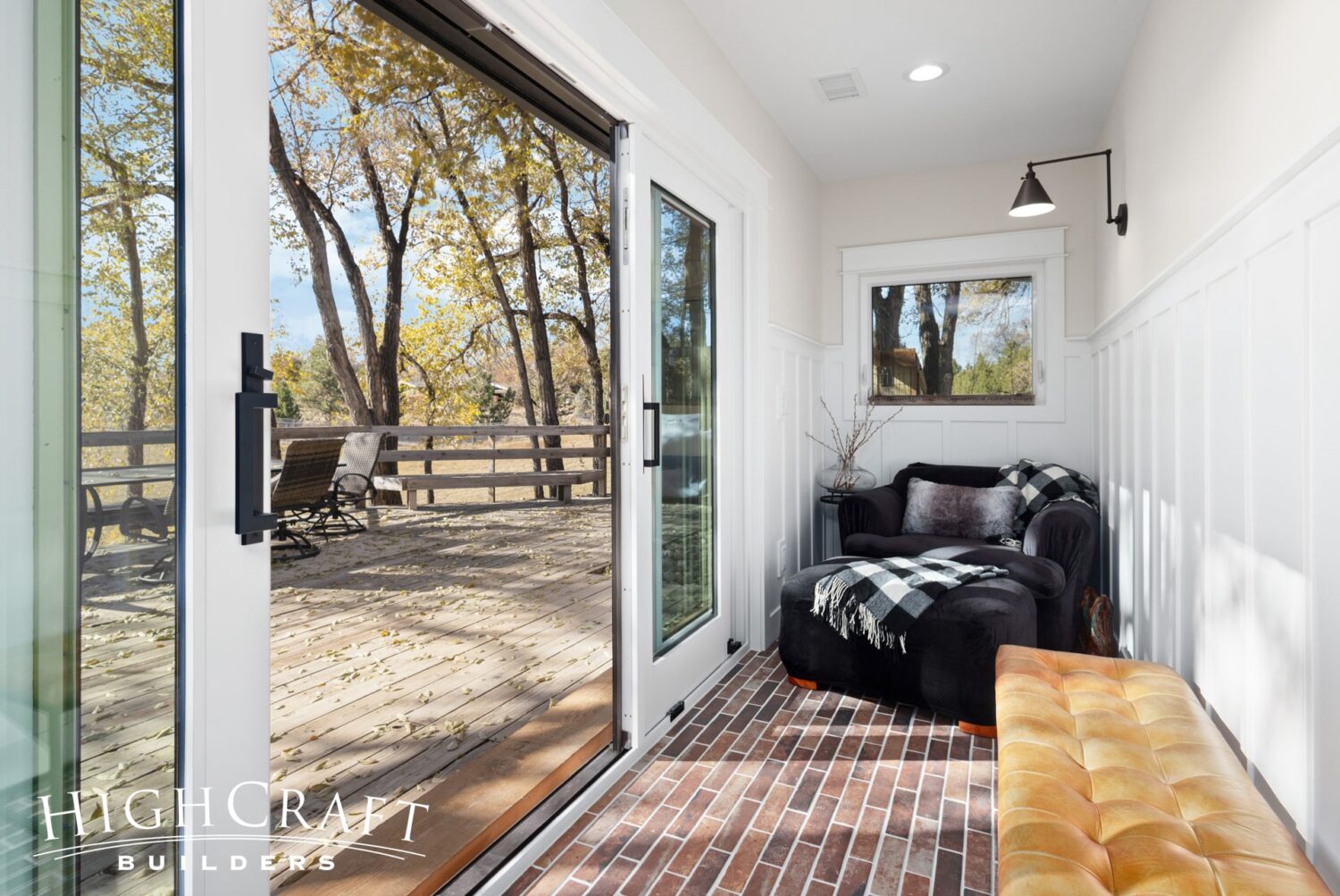fort-collins-colorado-house-remodel-mudroom-hallway-sliding-doors-to-deck