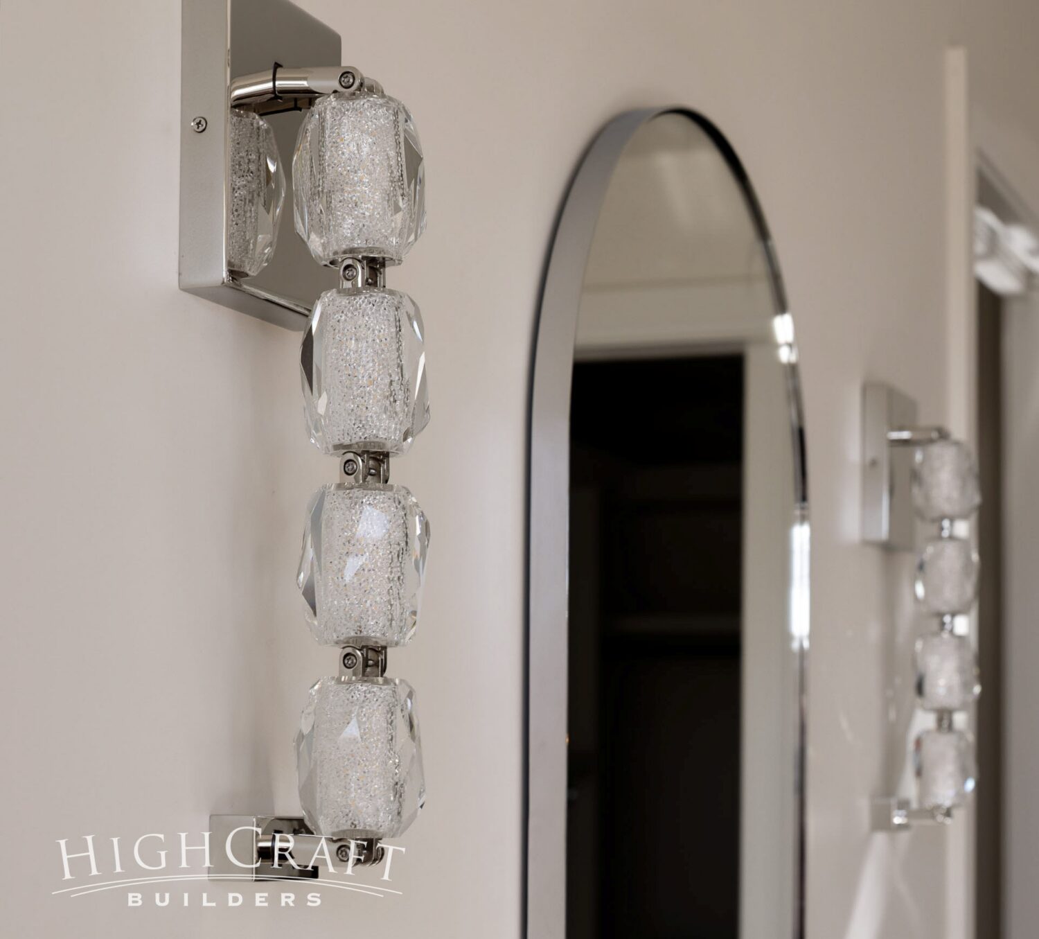 timnath-co-bathroom-remodel-capsule-mirrors-crystal-wall-sconces-detail