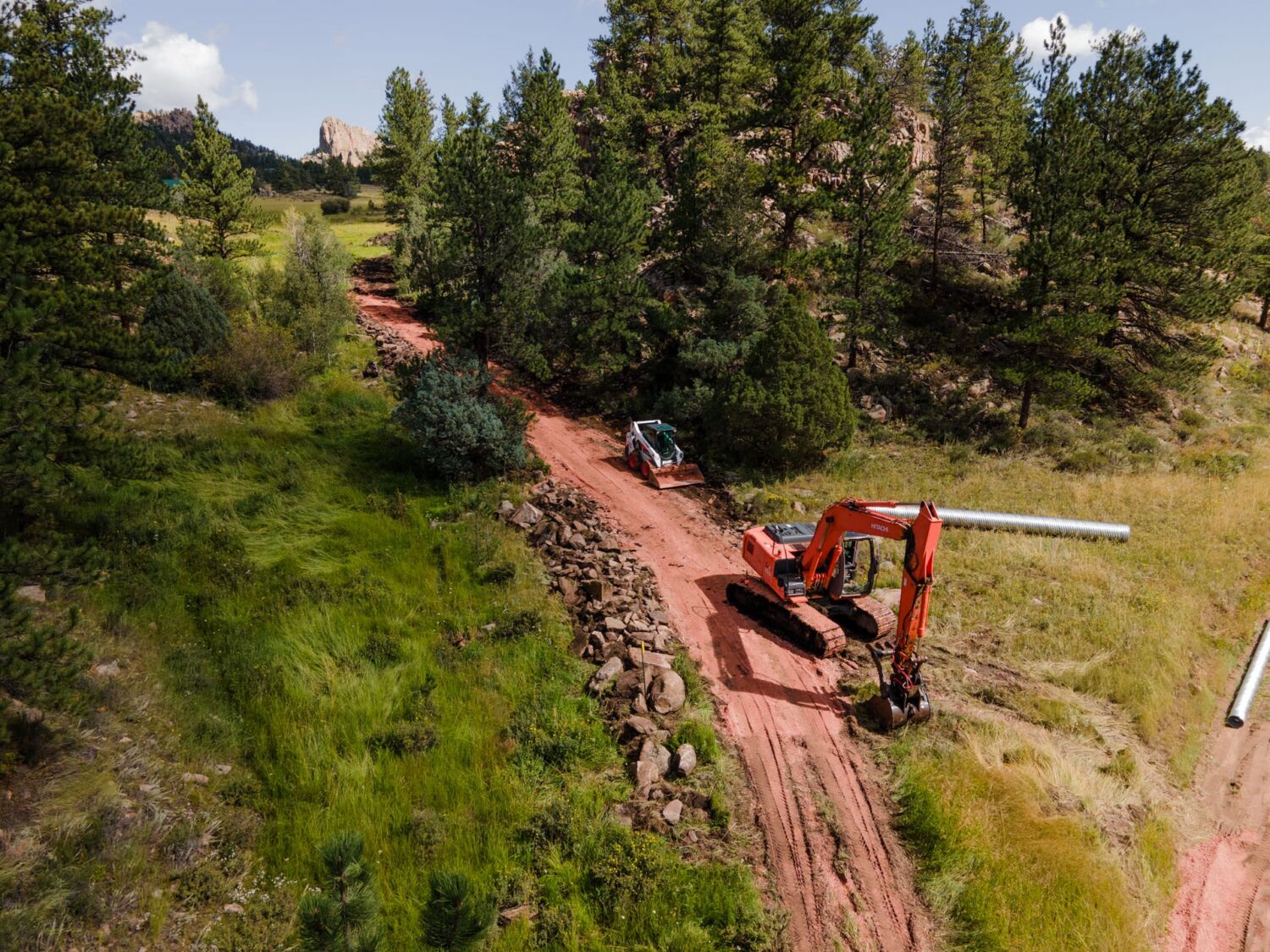 custom-home-builder-red-feather-lakes-cutting-in-road