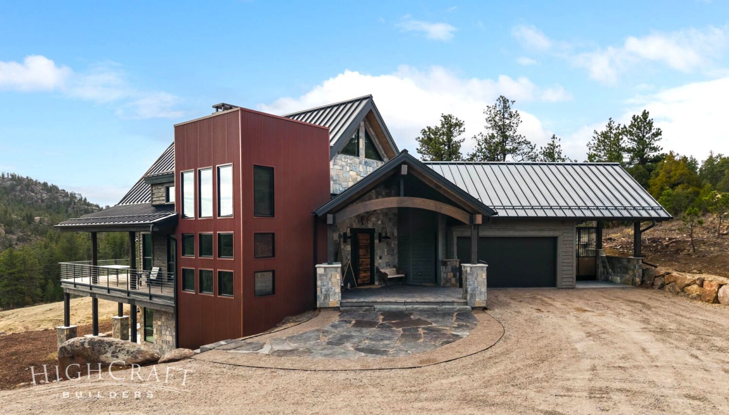 home-builder-near-me-red-feather-lakes-co-front-exterior-tower-stone-metal-roof