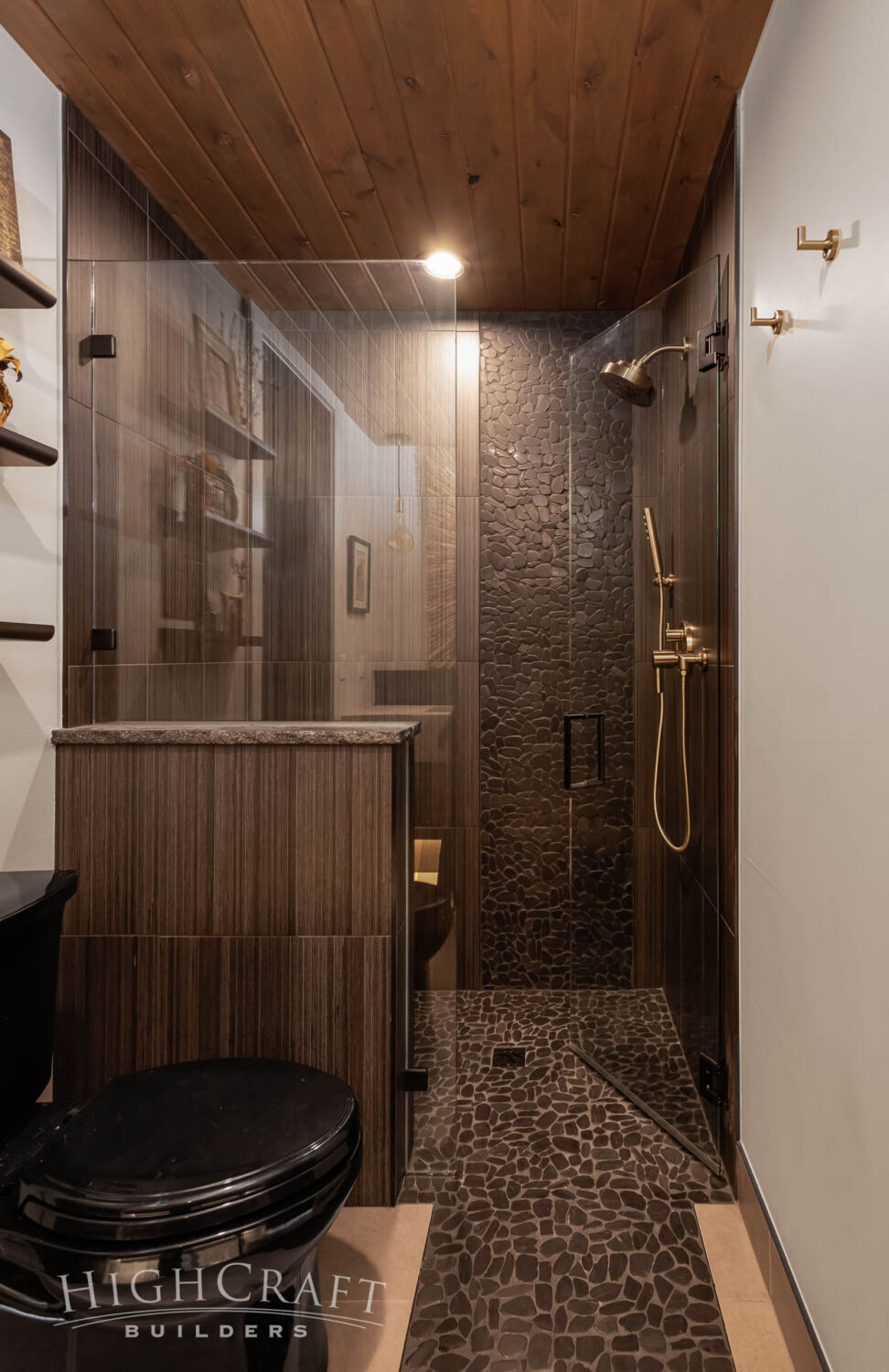 home-builder-near-me-red-feather-lakes-co-main-floor-guest-bathroom-shower-black-pebbles