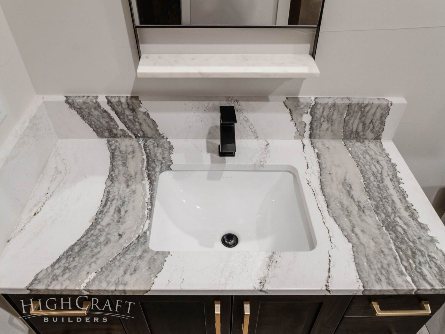 custom-home-builder-red-feather-lakes-bathroom-quartz-countertop-veined