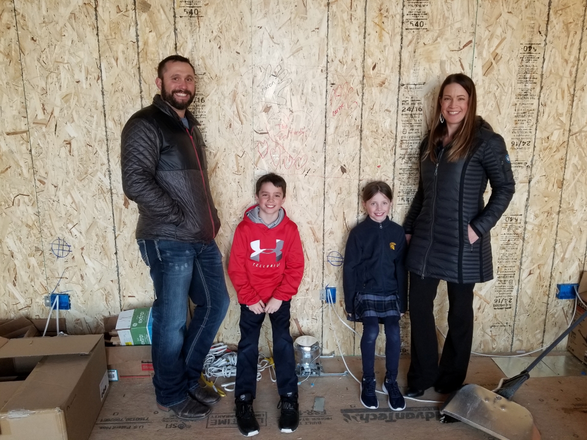 loveland-home-builder-clients-writing-on-framing
